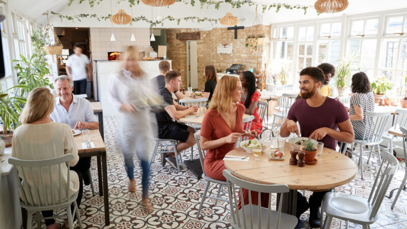 Lunchtime customers eating at a busy restaurant